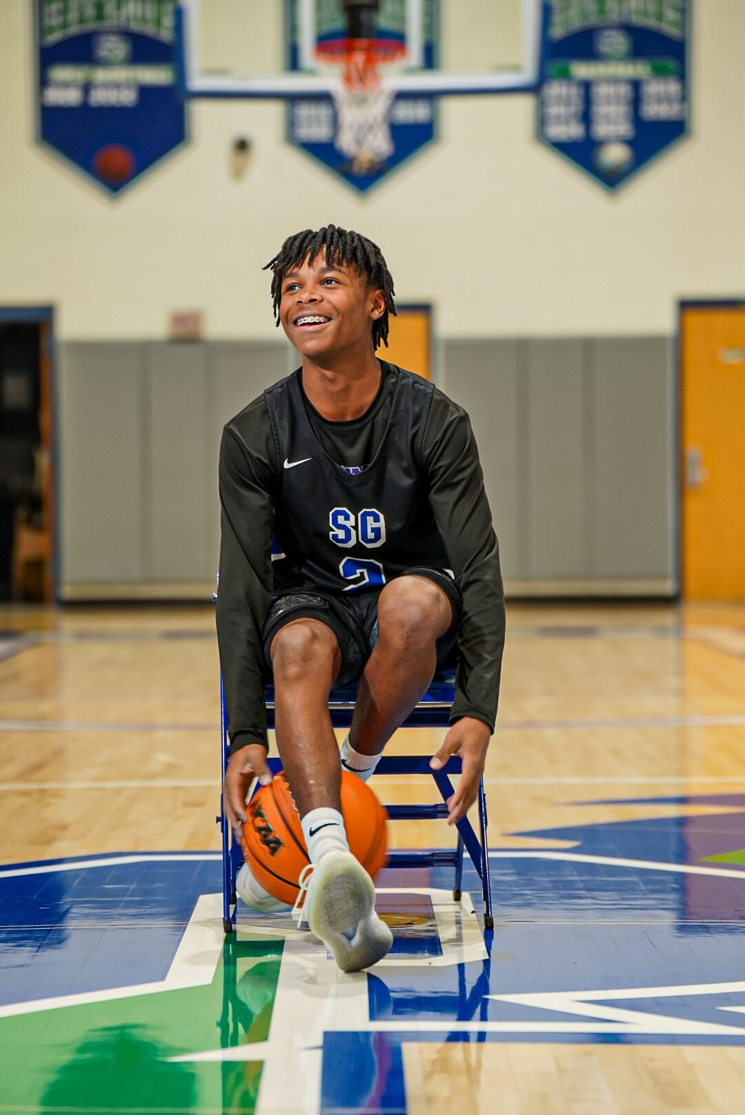 A smiling St. Georges player at center court